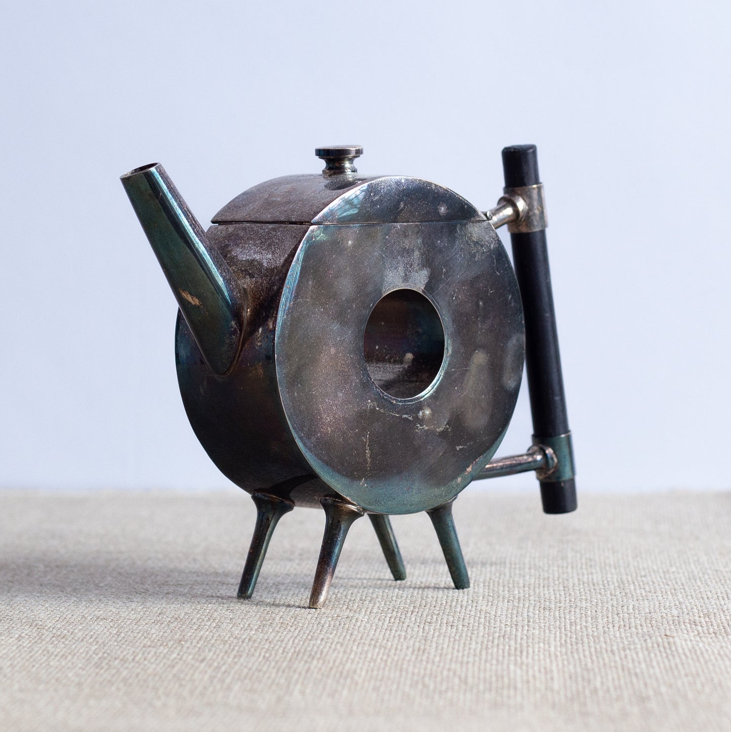 Silverplated Donut Teapot, Christopher Dresser, England. C20th.