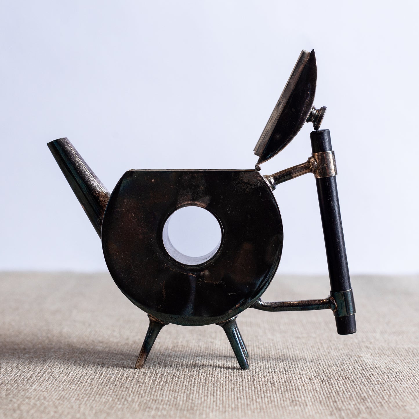Silverplated Donut Teapot, Christopher Dresser, England. C20th.