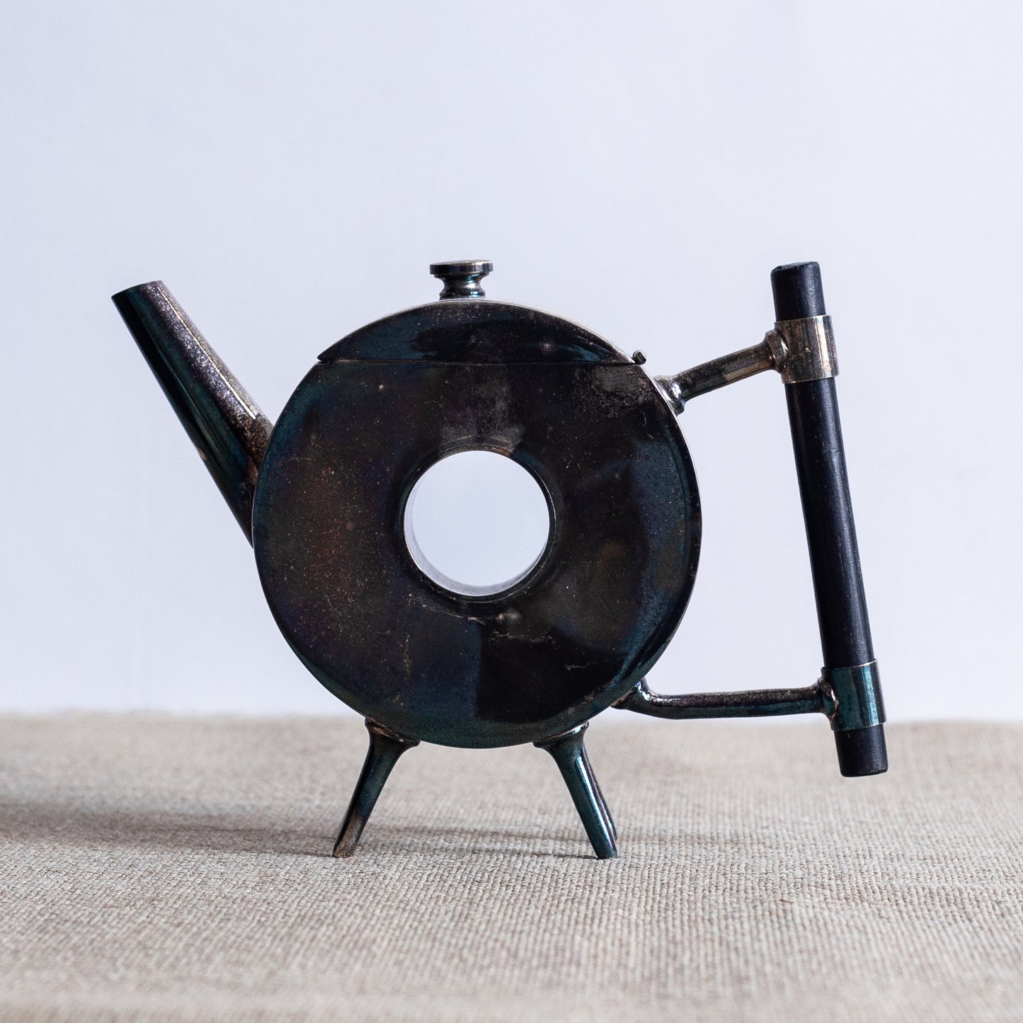 Silverplated Donut Teapot, Christopher Dresser, England. C20th.