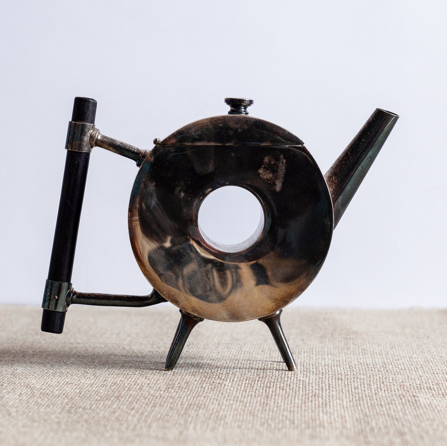 Silverplated Donut Teapot, Christopher Dresser, England. C20th.