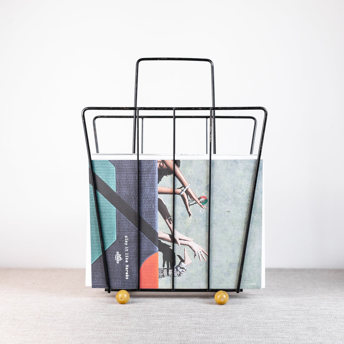 Atomic-age magazine rack, England. 1960s.