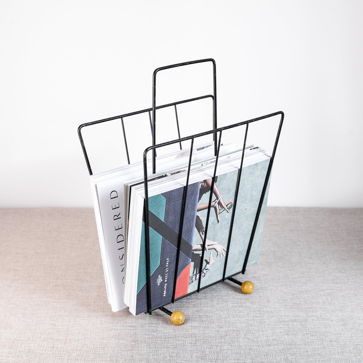 Atomic-age magazine rack, England. 1960s.