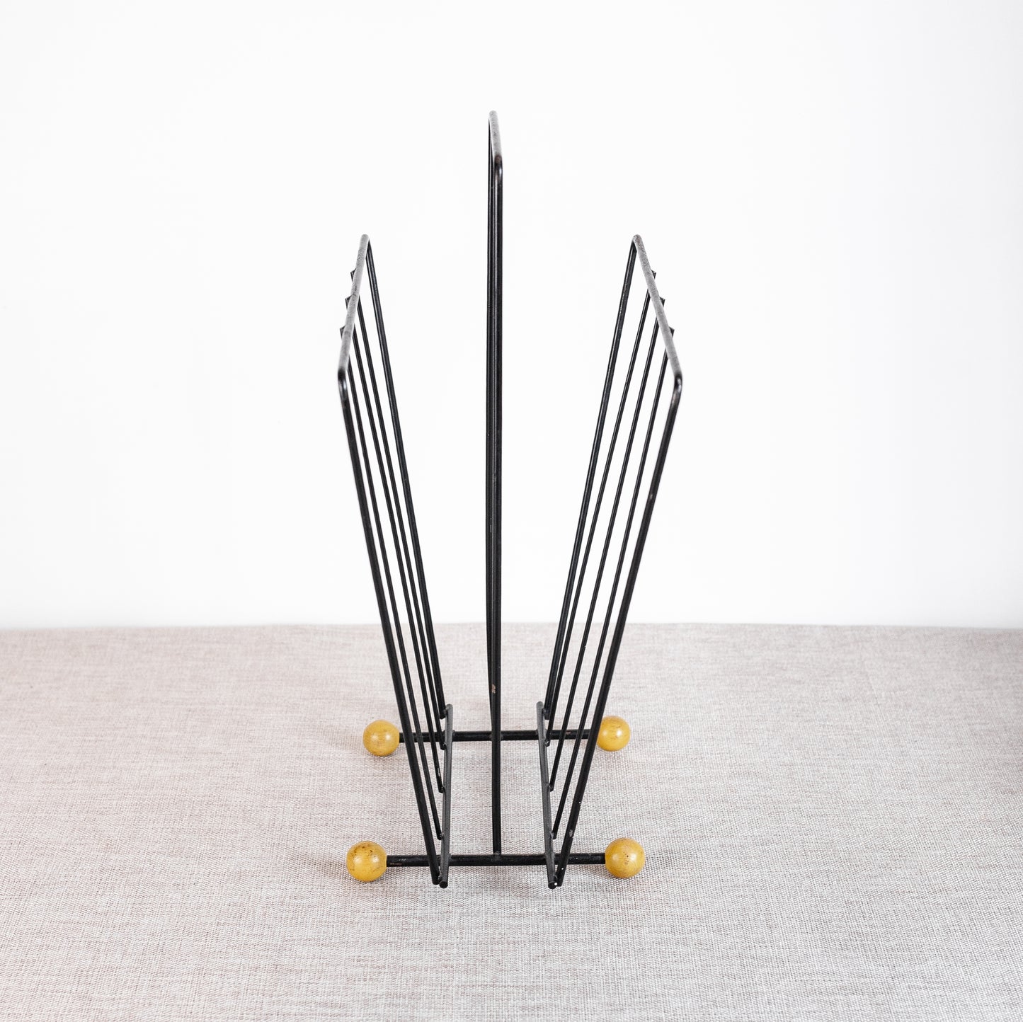 Atomic-age magazine rack, England. 1960s.
