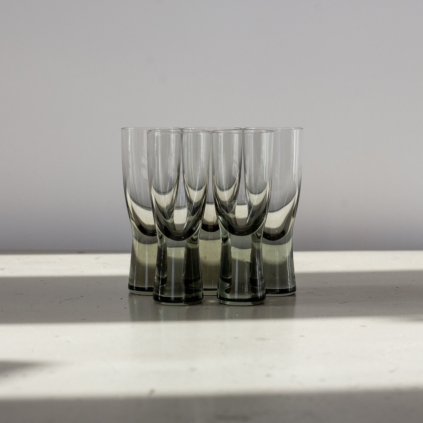 Set of 5 ‘Canada Smoke’ schnapps glasses and ‘Donut’ decanter, Per Lutken, Holmegaard, Denmark. 1950’s.