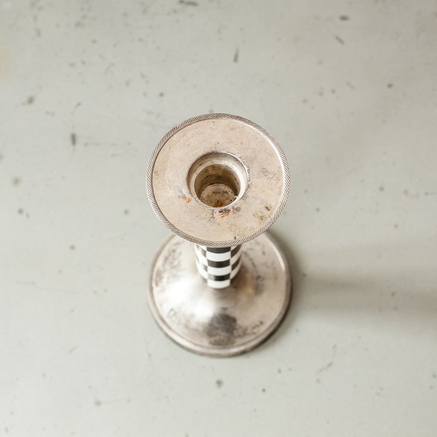 Pewter and faux ivory chequered candlestick. Mid-20th Century.