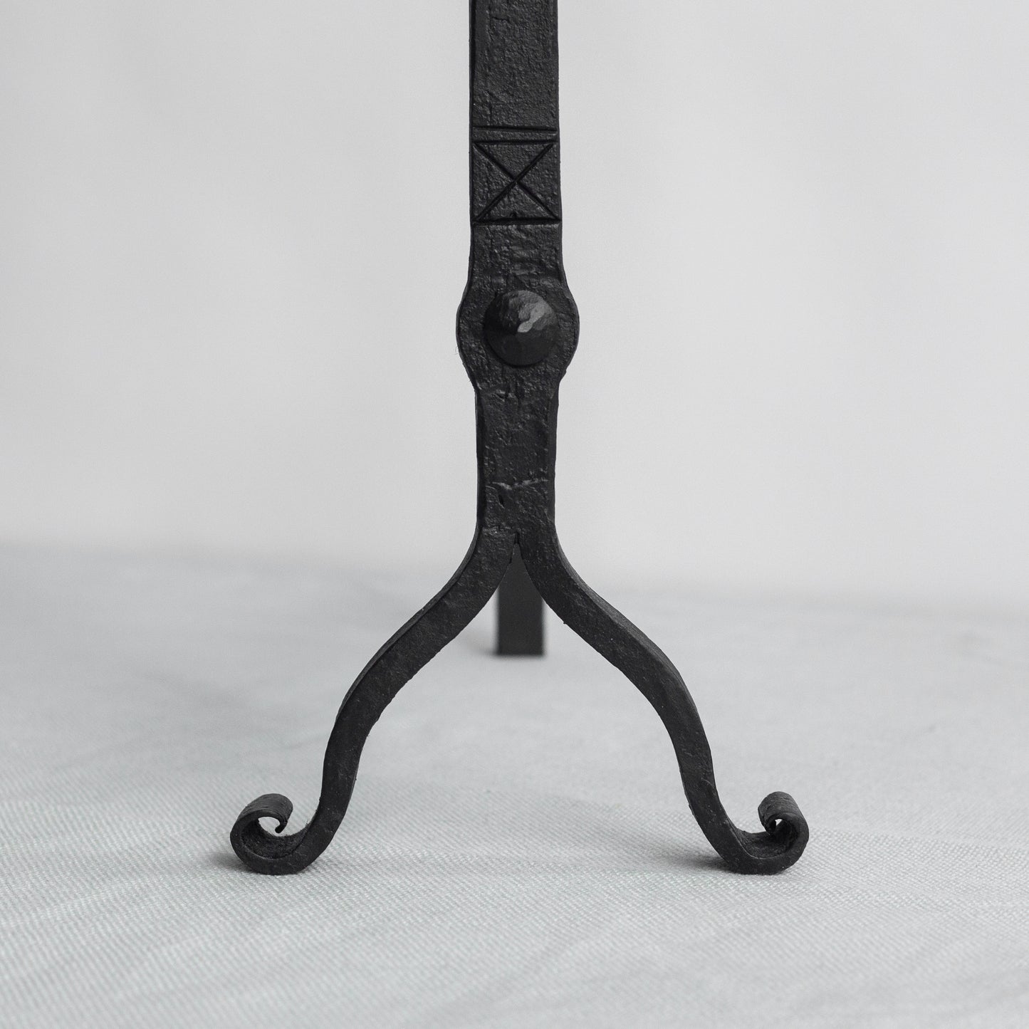 Pair of Arts and Crafts iron fire dogs, England. Early 20th Century.