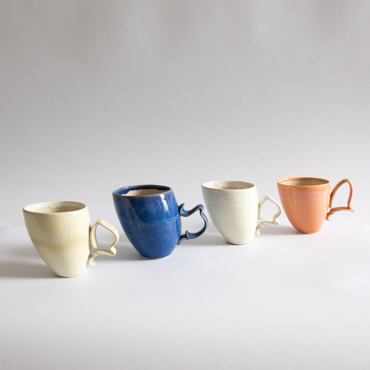 'Tango' Stoneware Mug in Peach, Jaroslav Hrustalenko, England. 2000s.