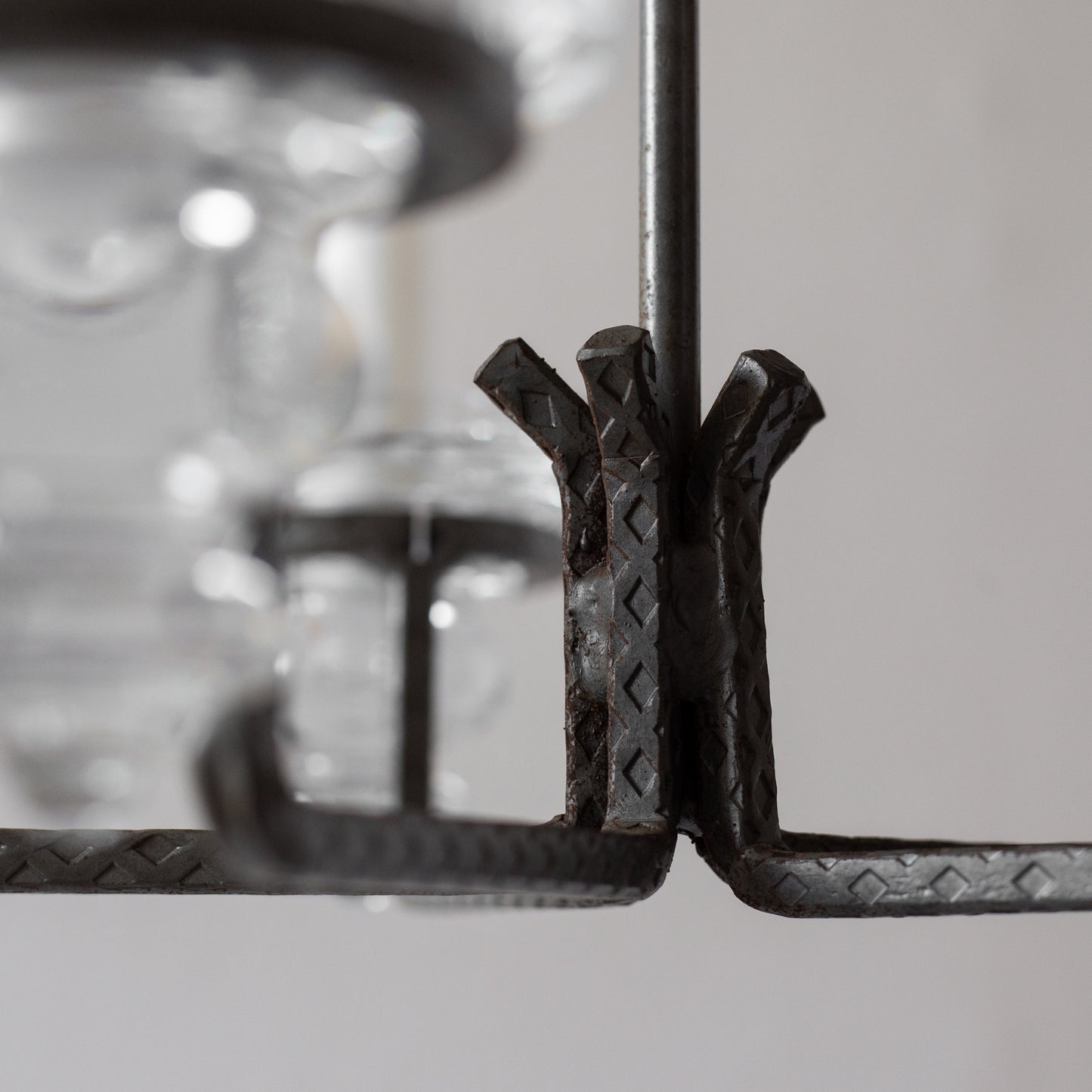 Iron and Glass Chandelier in the manner of Bertil Vallien, Sweden. 1960’s.