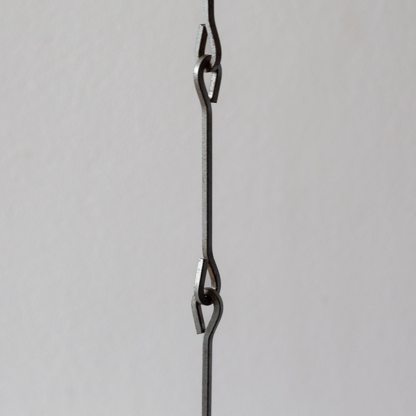 Iron and Glass Chandelier in the manner of Bertil Vallien, Sweden. 1960’s.