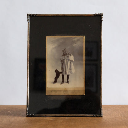 Framed Cabinet Photograph of a Girl with a Dog, G & R Lavis, England. Circa 1890.