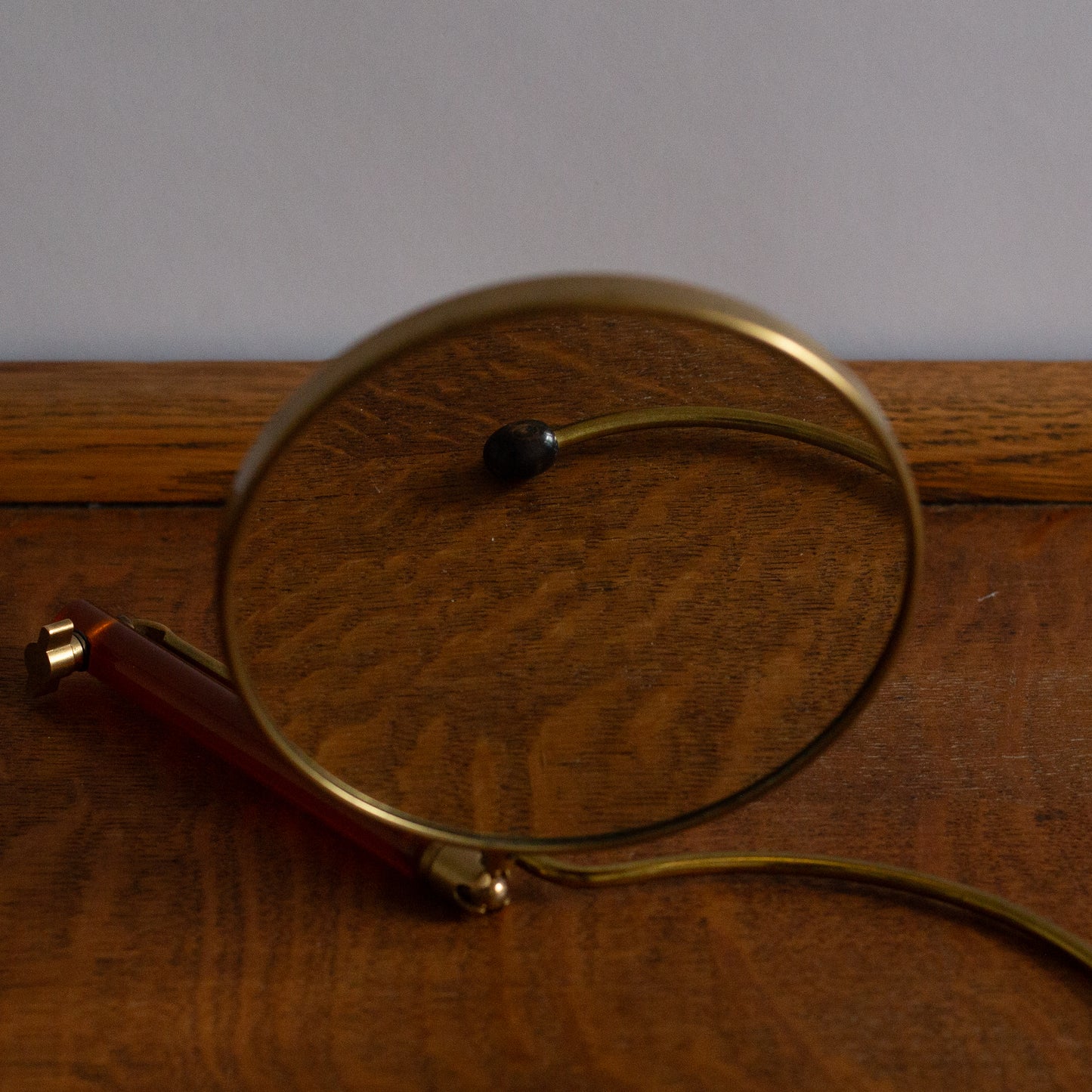 Adjustable Lucite and Brass table/hand mirror, France. 1950’s.