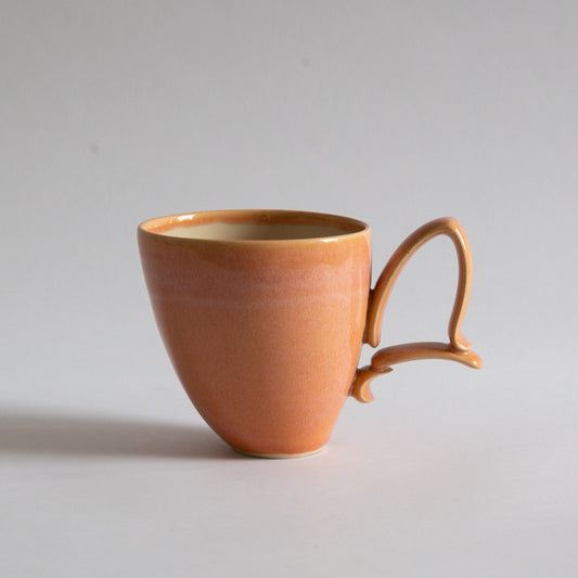 'Tango' Stoneware Mug in Peach, Jaroslav Hrustalenko, England. 2000s.