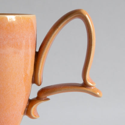 'Tango' Stoneware Mug in Peach, Jaroslav Hrustalenko, England. 2000s.