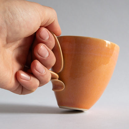 'Tango' Stoneware Mug in Peach, Jaroslav Hrustalenko, England. 2000s.