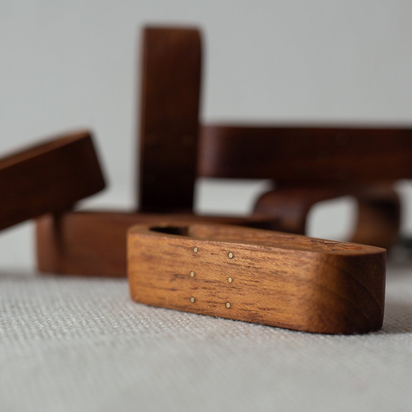 Set of six teak and brass napkin rings, Laurids Lønborg, Denmark. 1950s.