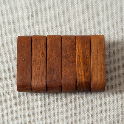 Set of six teak and brass napkin rings, Laurids Lønborg, Denmark. 1950s.