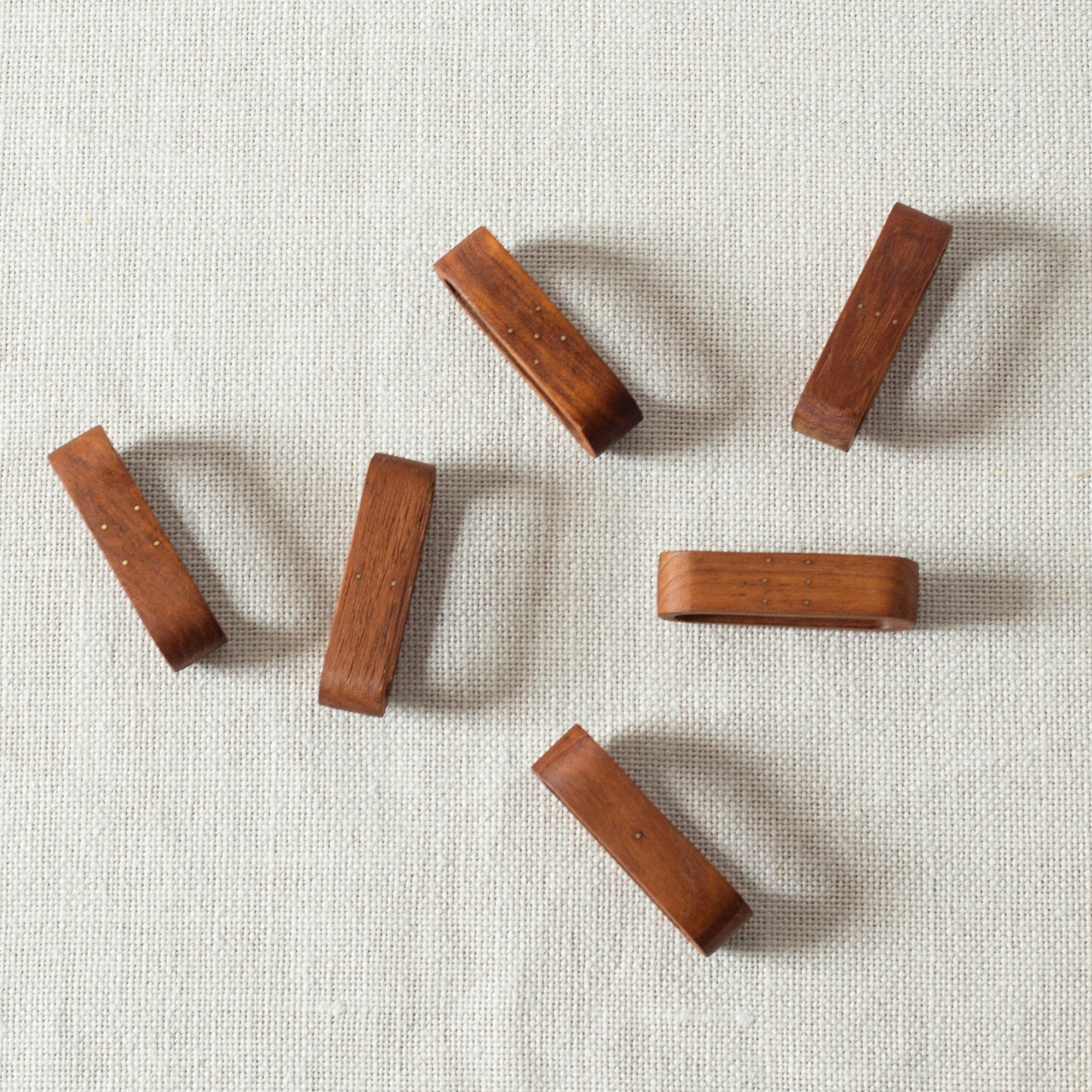 Set of six teak and brass napkin rings, Laurids Lønborg, Denmark. 1950s.