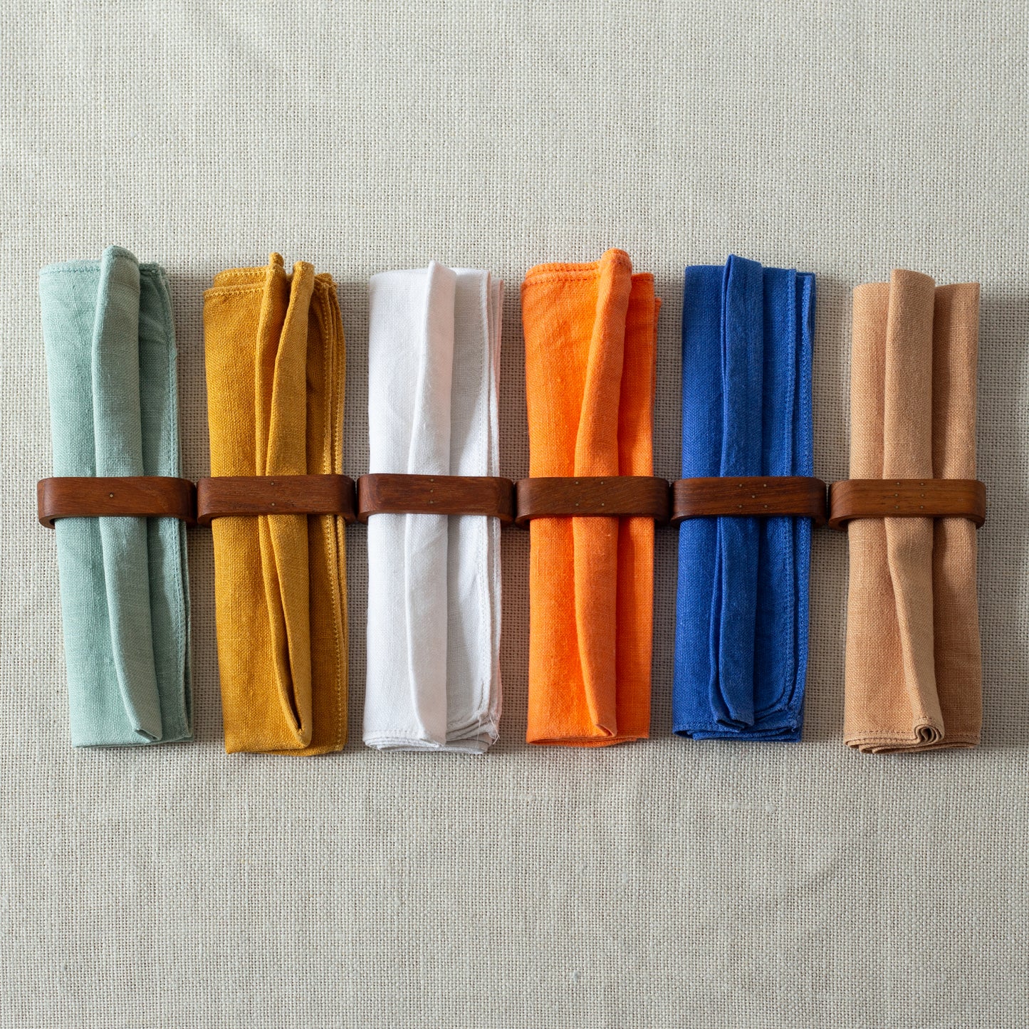 Set of six teak and brass napkin rings, Laurids Lønborg, Denmark. 1950s.