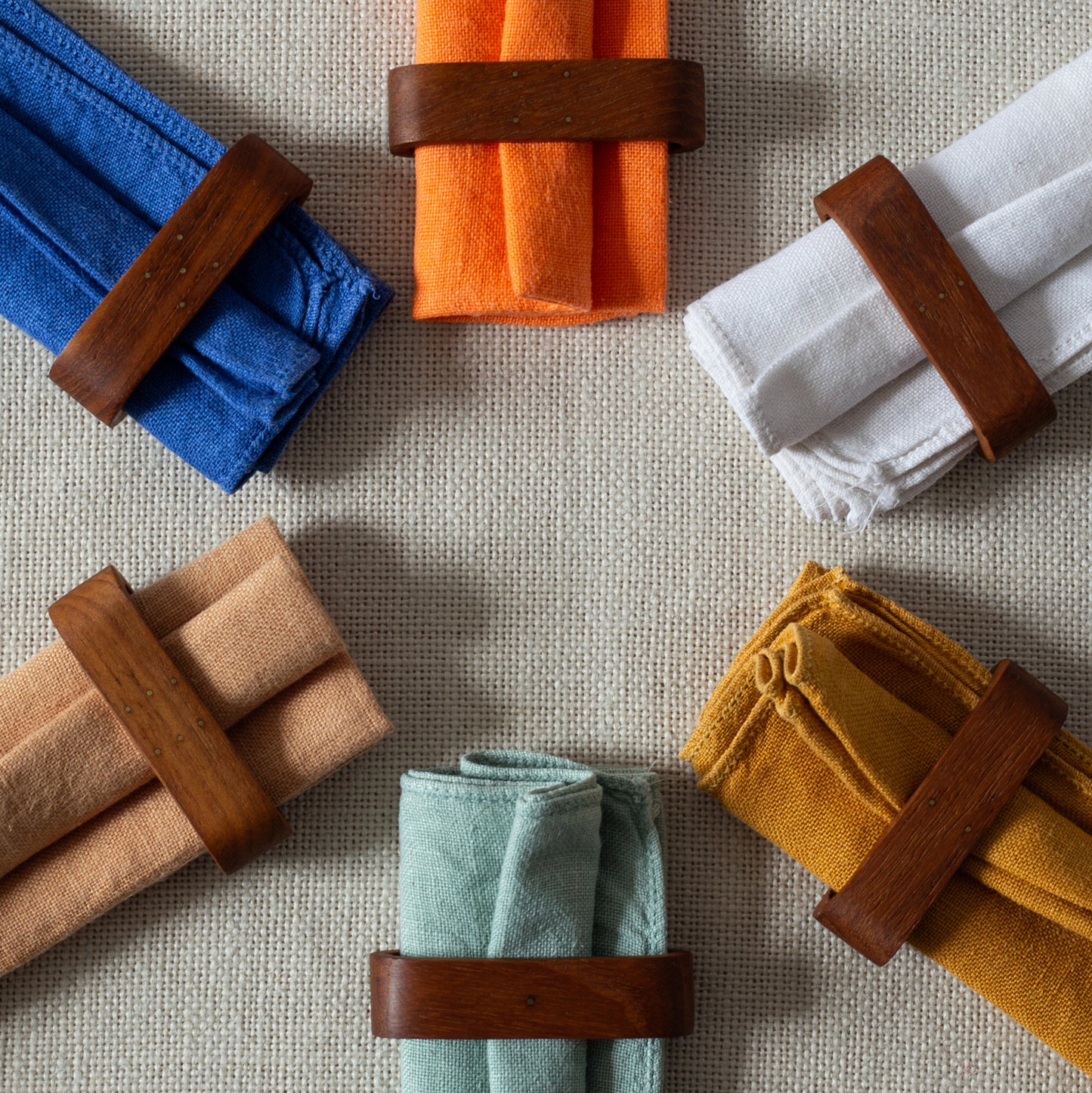 Set of six teak and brass napkin rings, Laurids Lønborg, Denmark. 1950s.