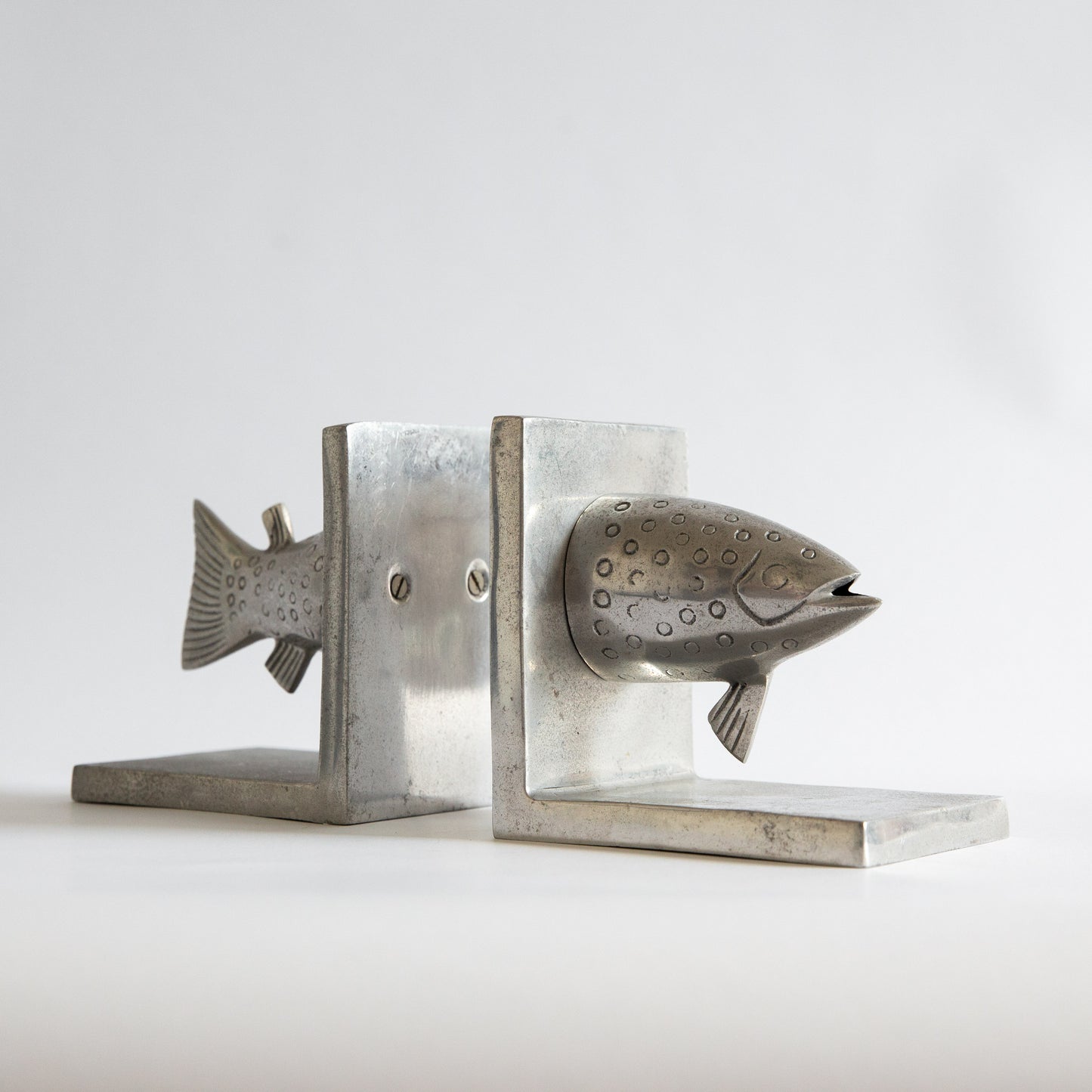 Pair of Postmodern Cast Aluminium Fish Bookends. Early 2000s.