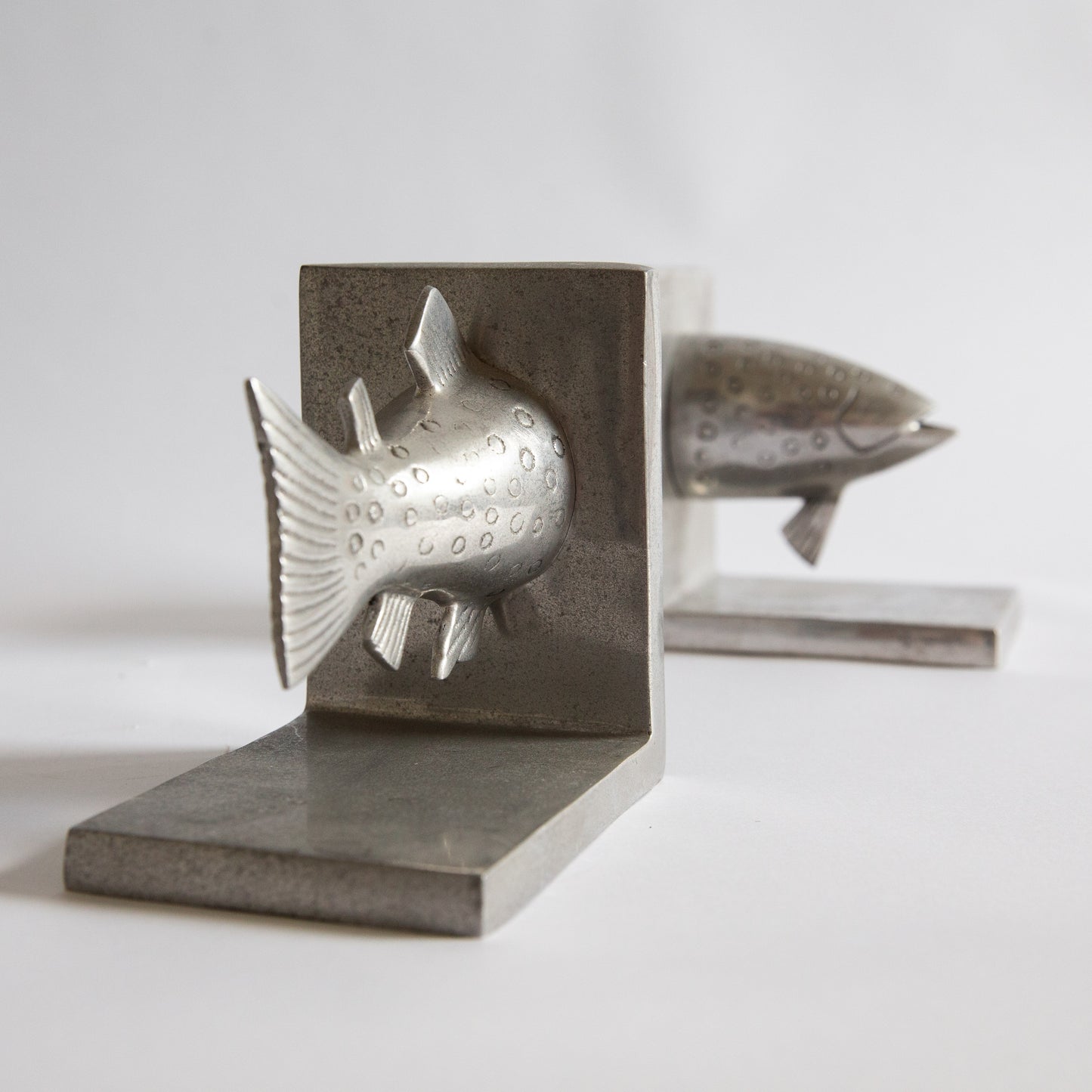 Pair of Postmodern Cast Aluminium Fish Bookends. Early 2000s.